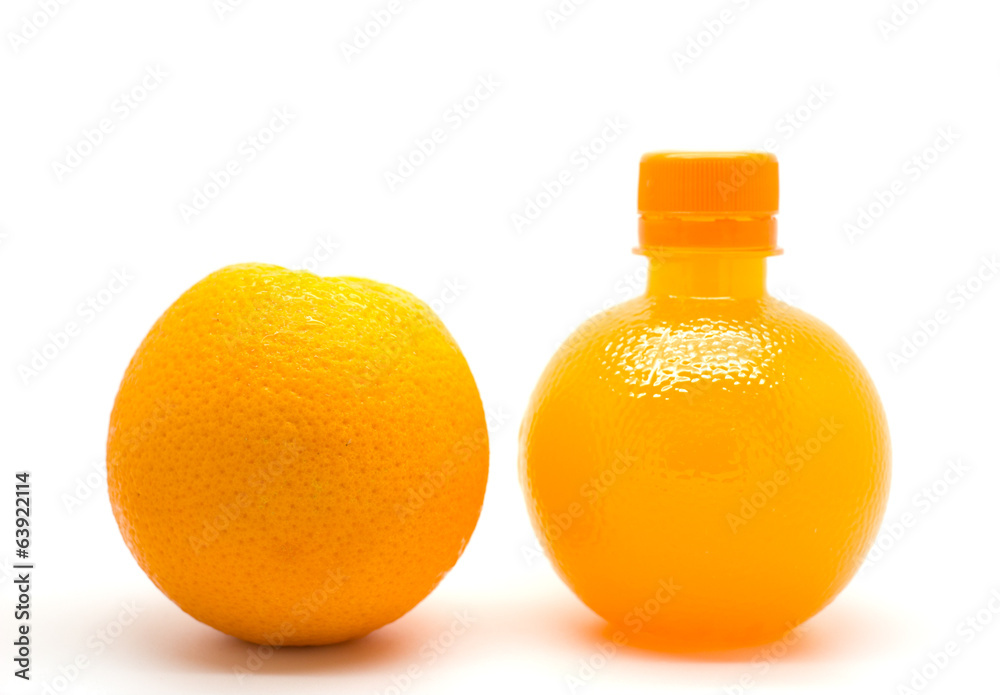 Orange slice and a bottle of fresh orange juice Orange slice and a bottle of fresh orange juice