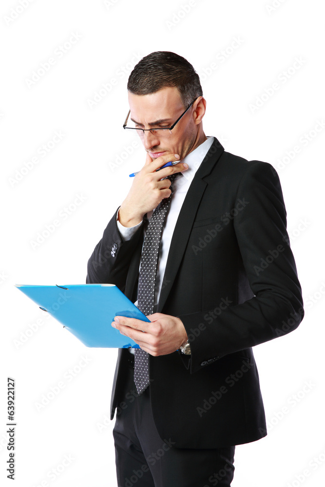 Handsome businessman reading document over white background Handsome businessman reading document over white background