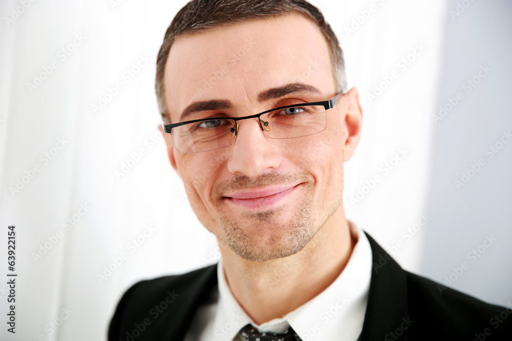 Portrait of a smiling businessman in glasses Portrait of a smiling businessman in glasses
