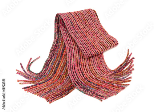 Pink winter fringe scarf nicely arranged. Wool scarf isolated.