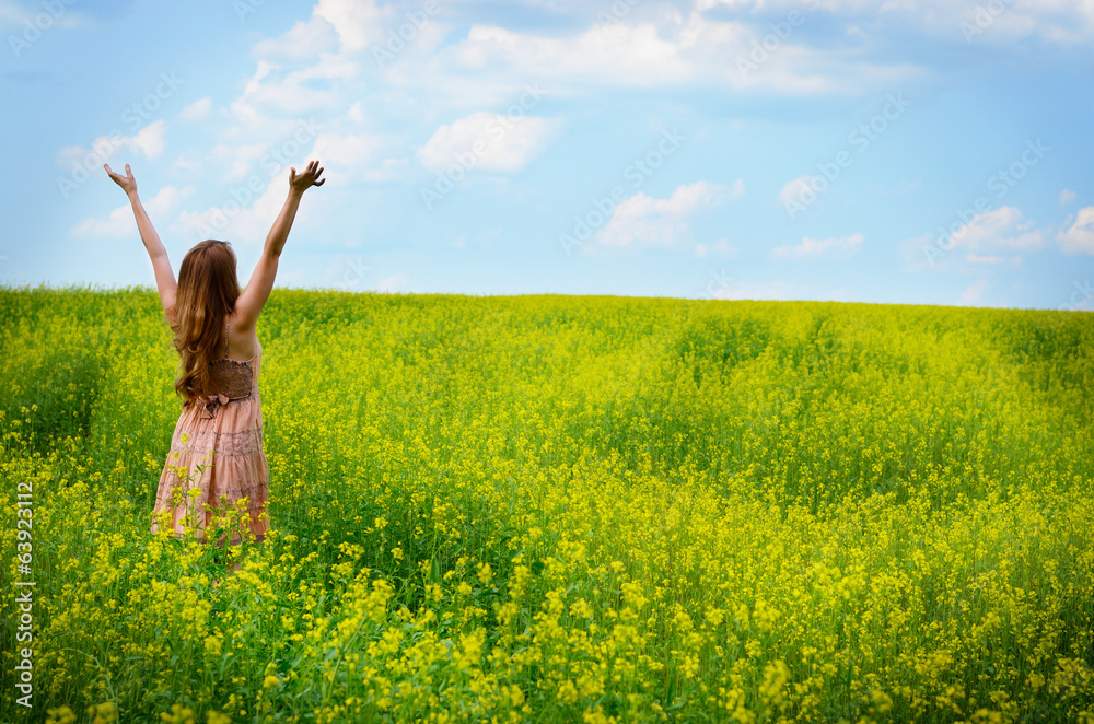 Young woman at canola field Young woman at canola field