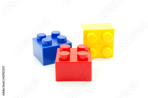 Plastic building blocks on white background