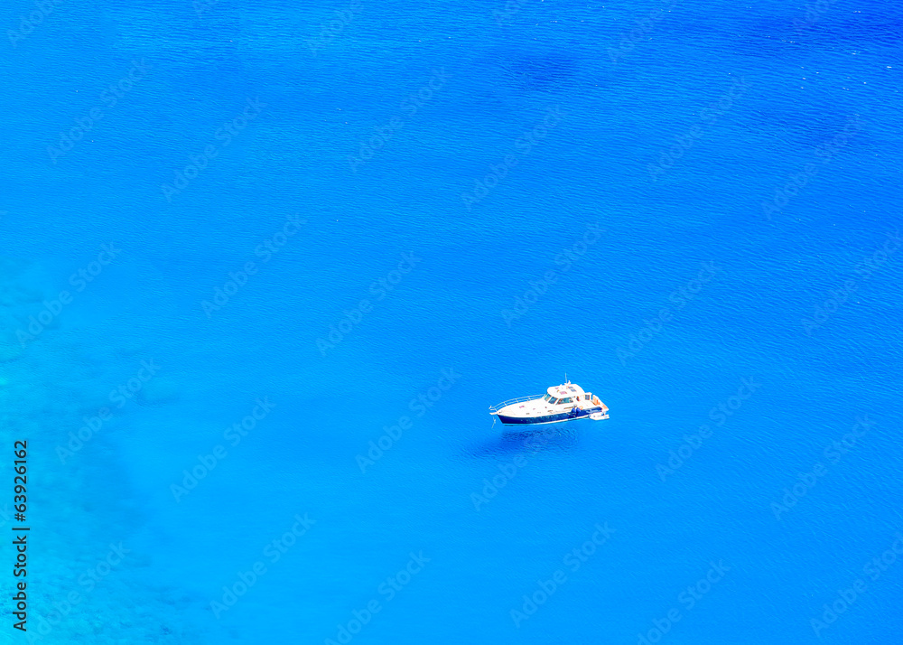 Motorized cruiser boat in the sea of Amorgos island in Greece Motorized cruiser boat in the sea of Amorgos island in Greece