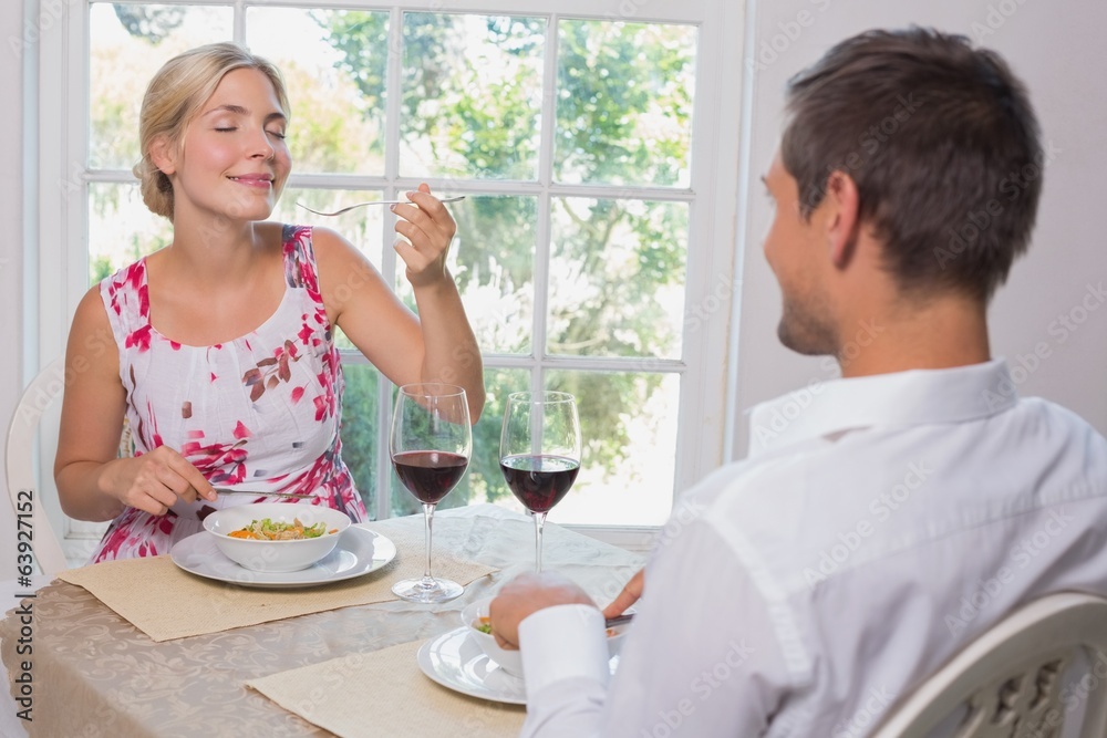 Happy couple enjoying food