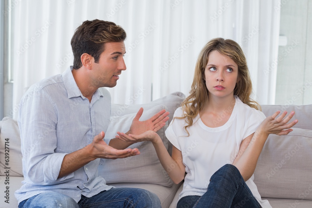 Couple having an argument in living room Couple having an argument in living room