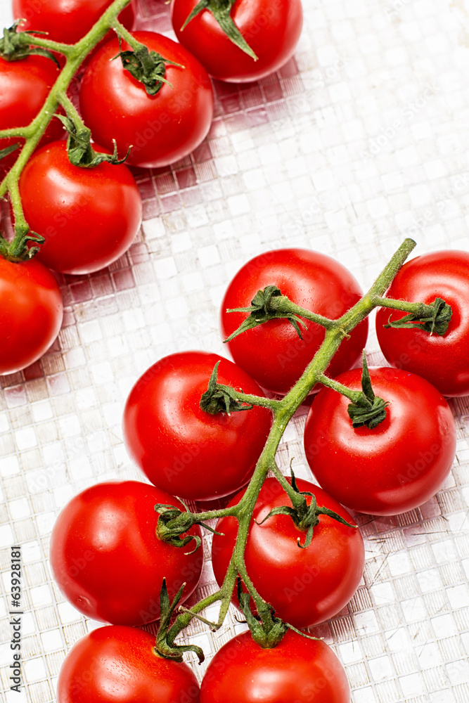 fresh tomatoes on branches