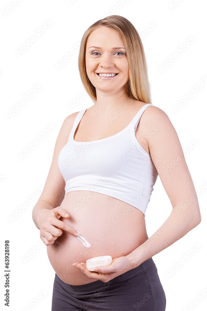 Woman applying moisturizer. Woman applying moisturizer.