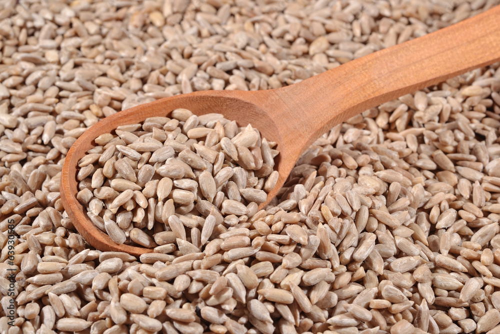 Cleared sunflower seeds in a spoon