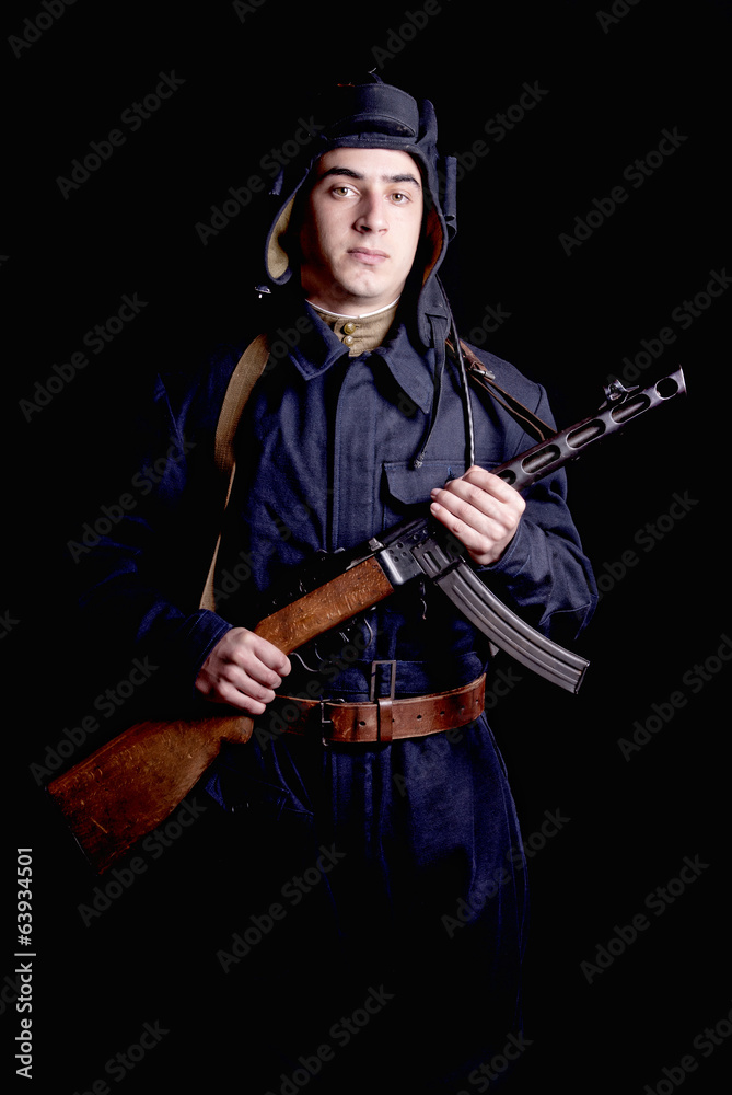 young Soviet tank driver with his gun young Soviet tank driver with his gun