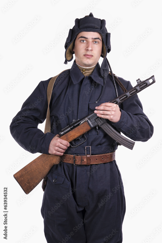 young Soviet tank driver with his gun young Soviet tank driver with his gun