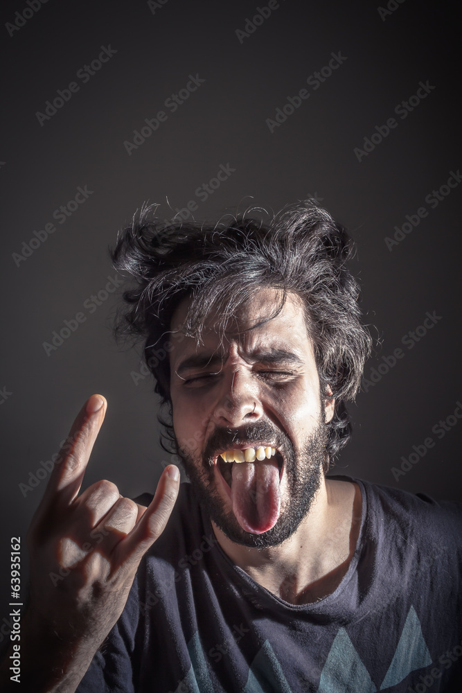 Rebel young doing the horns hand Rebel young doing the horns hand