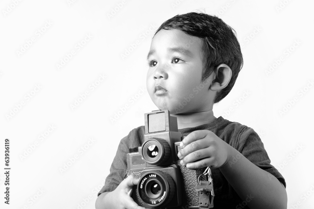 Fototapeta premium Baby holding film camera