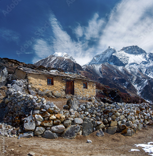 Stone cabin in the mountain, along the trail to Mount Everest Ba photo