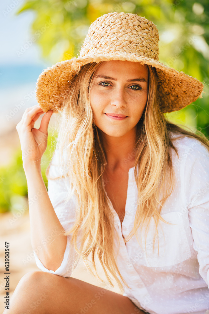 Portrait of beautiful blond girl on the beach