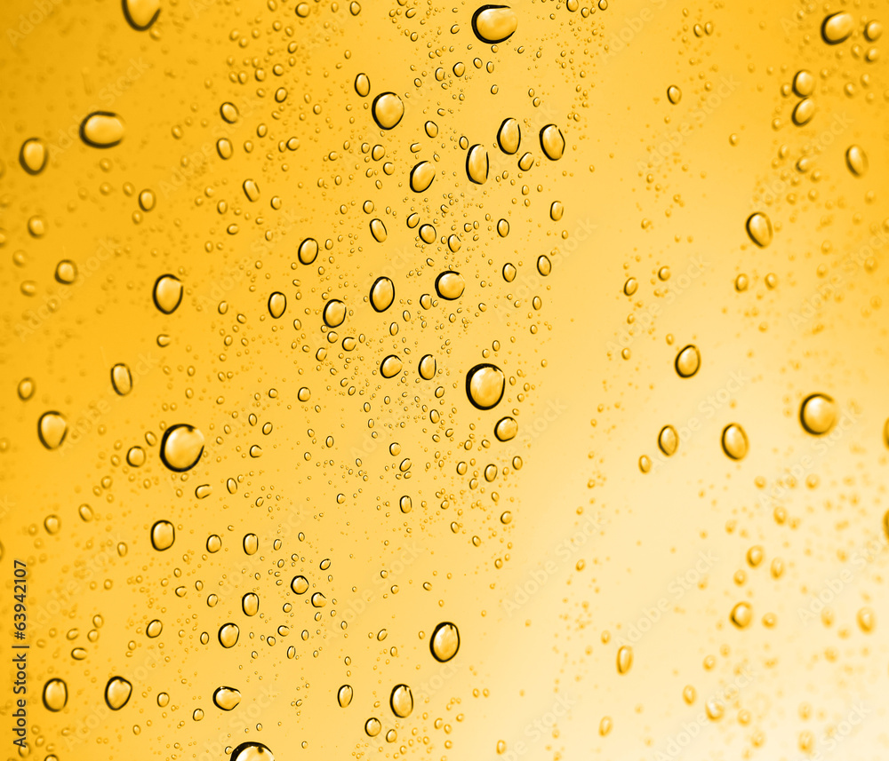 golden water drops on glass golden water drops on glass