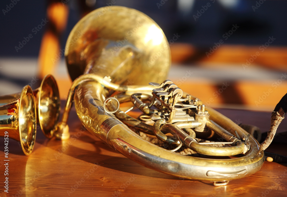 Fototapeta premium Blowing brass instrument on table