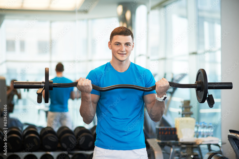 man doing exercises with barbell man doing exercises with barbell