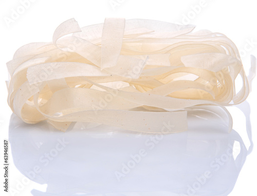 Dried kway teow over white background photo