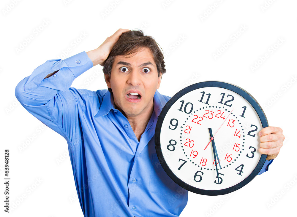 Time running out. Stressed business man holding clock Time running out. Stressed business man holding clock