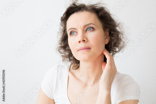 Brown-haired woman thinking about something