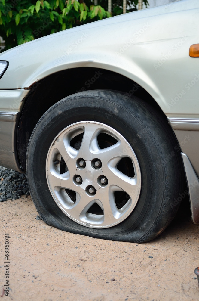 Naklejka premium Flat tire on car