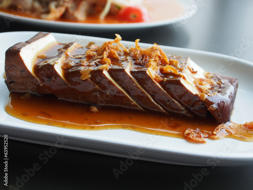 Chinese food Tofu (Soy-bean Curd) with soy sauce on white dish