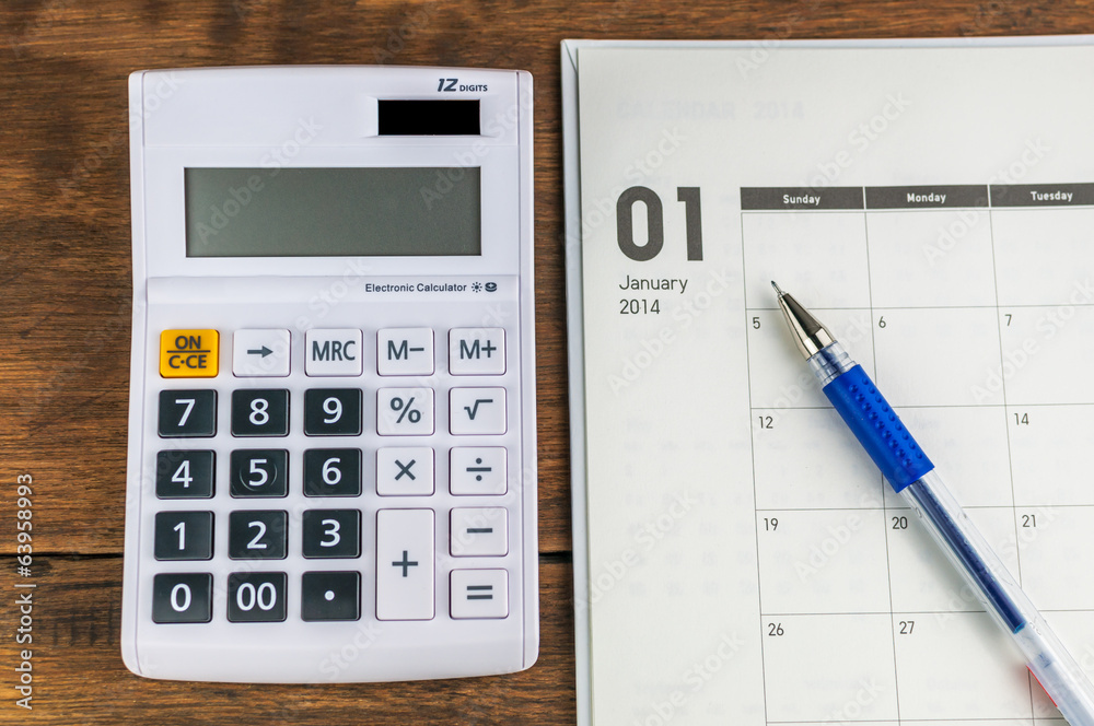January organizer with calculator & pen: concept for monthly bud January organizer with calculator & pen: concept for monthly bud