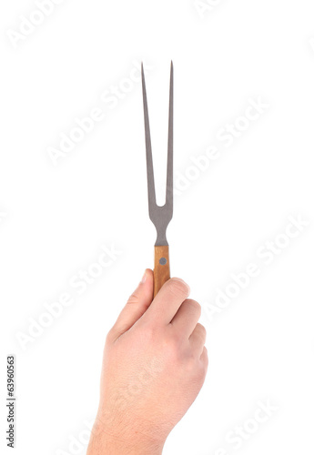 Hand holds fork.