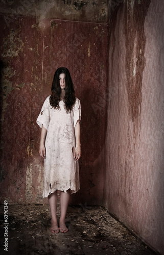 Horror style image - alone girl in creepy house