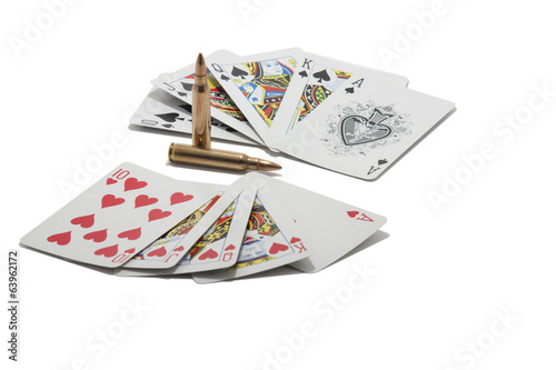 Royal flush and two cartridges isolated on white background