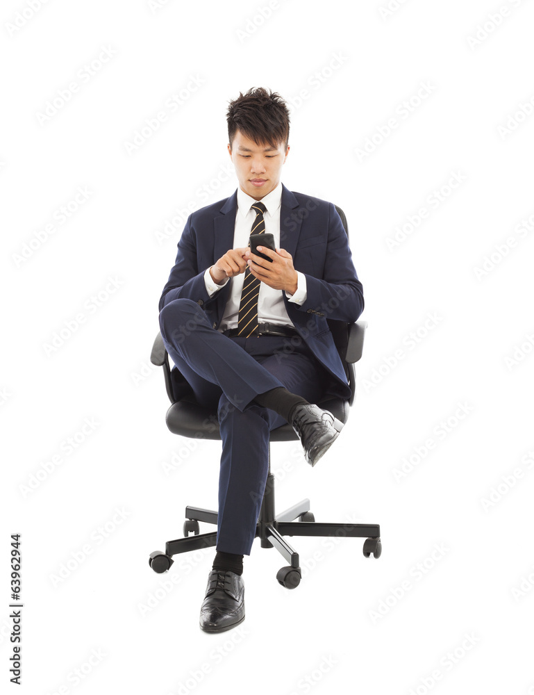 asian businessman touching smart phone on chair asian businessman touching smart phone on chair