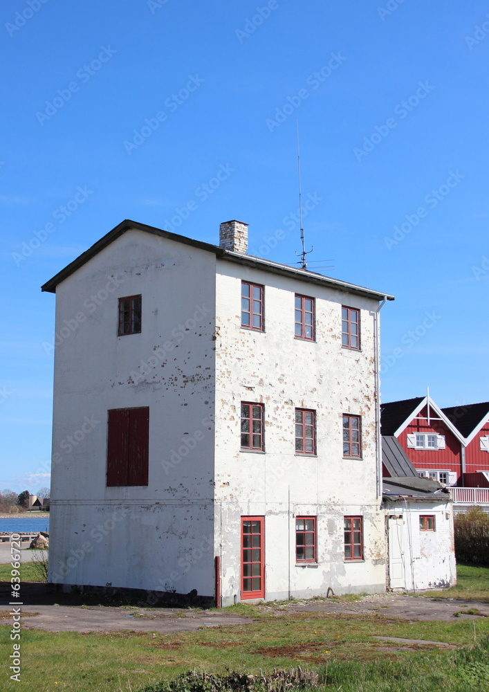 Isolated abandoned three storage building near new houses Isolated abandoned three storage building near new houses