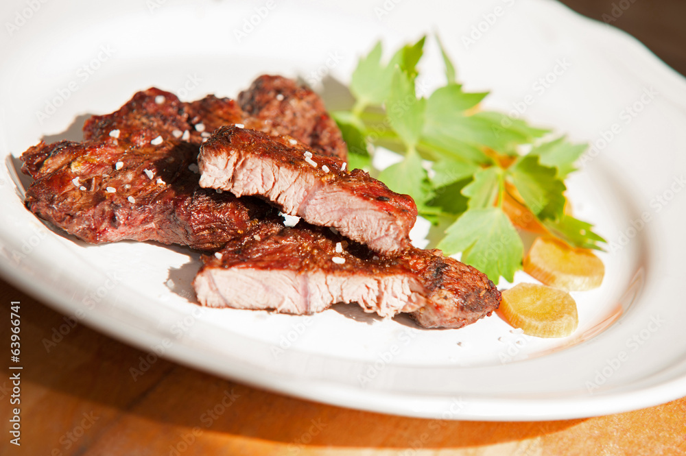 Delicous steak with vegetables on