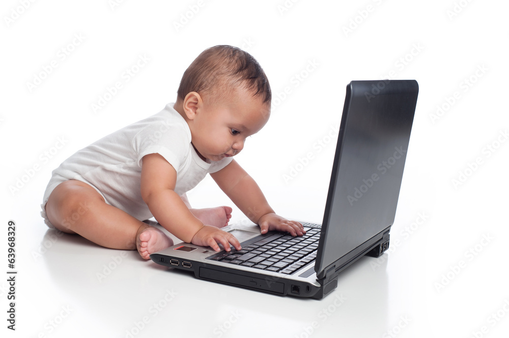 Baby Boy Typing on a Laptop Computer Baby Boy Typing on a Laptop Computer