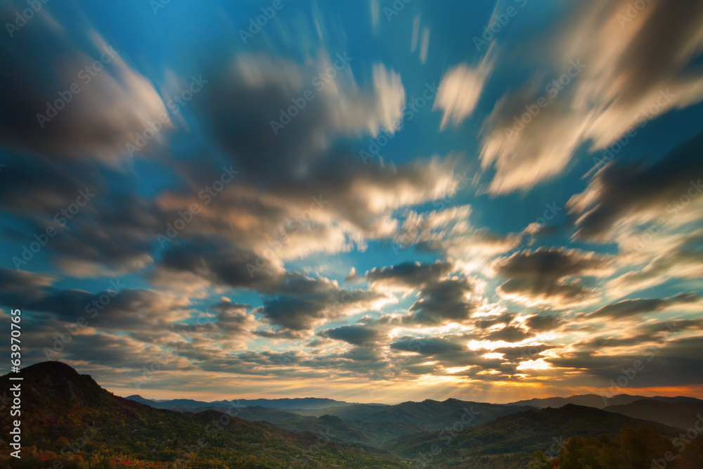 Sunshine and blue sky with clouds moving