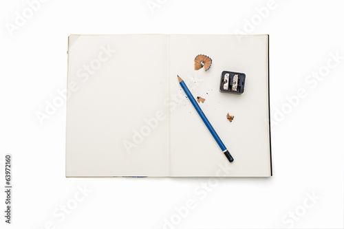 open blank diary with pencil, sharpener and pencil shavings, iso