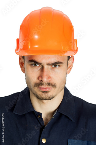 Funny worker in helmet with emotion on her face
