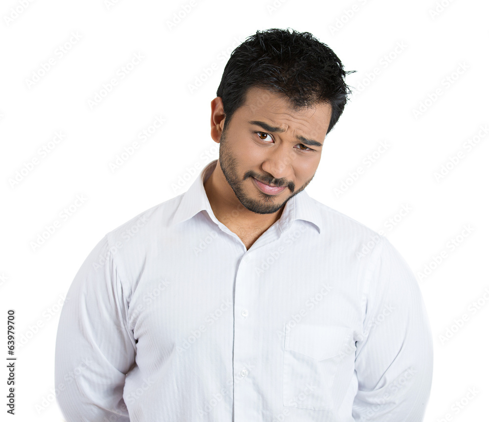 The skeptic. Cautious young business man questioning The skeptic. Cautious young business man questioning