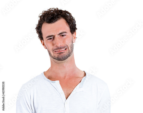 Misery young man with baby crying face expression