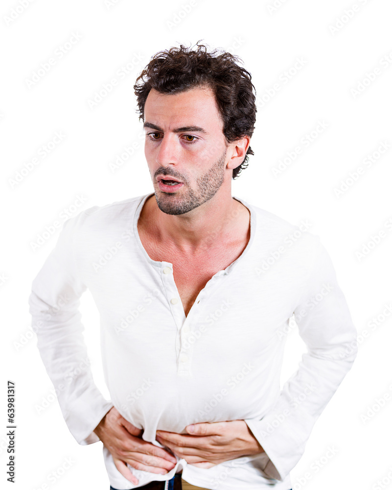 Young man having severe abdominal, stomach pain Young man having severe abdominal, stomach pain