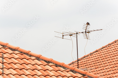 TV antenna on red roof