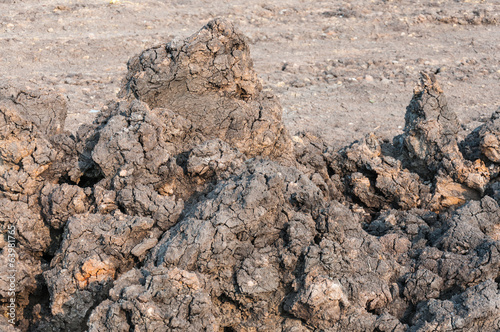 stack of soil at construction site © taweepat