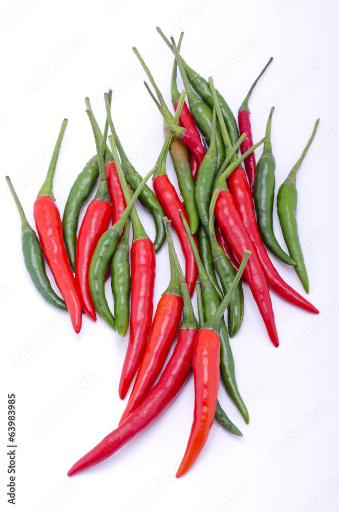 green and red pepper is isolated on a white background