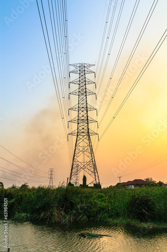 High voltage power lines at sunset.