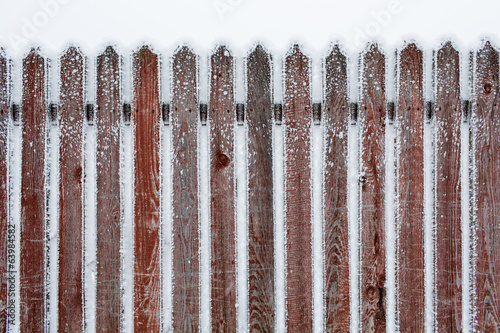 snow on a wooden fence as a background image