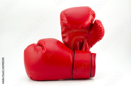 Pair of red leather boxing gloves isolated on white © piyathep