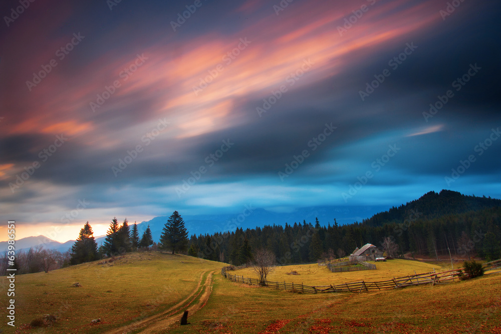 Fototapeta premium Traditional house in mountain with clouds moving