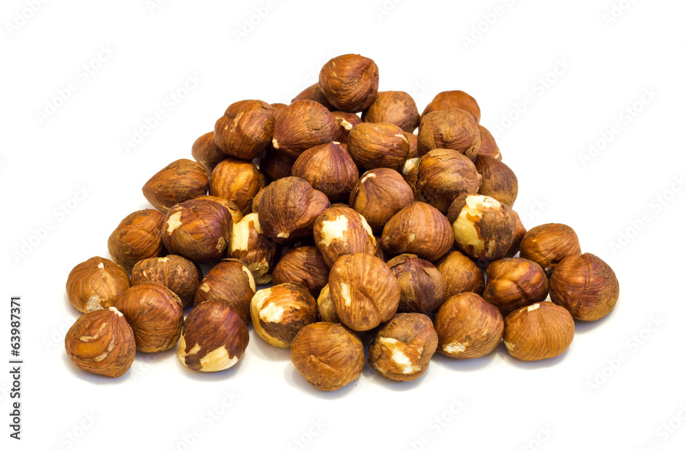 Heap of hazelnuts .