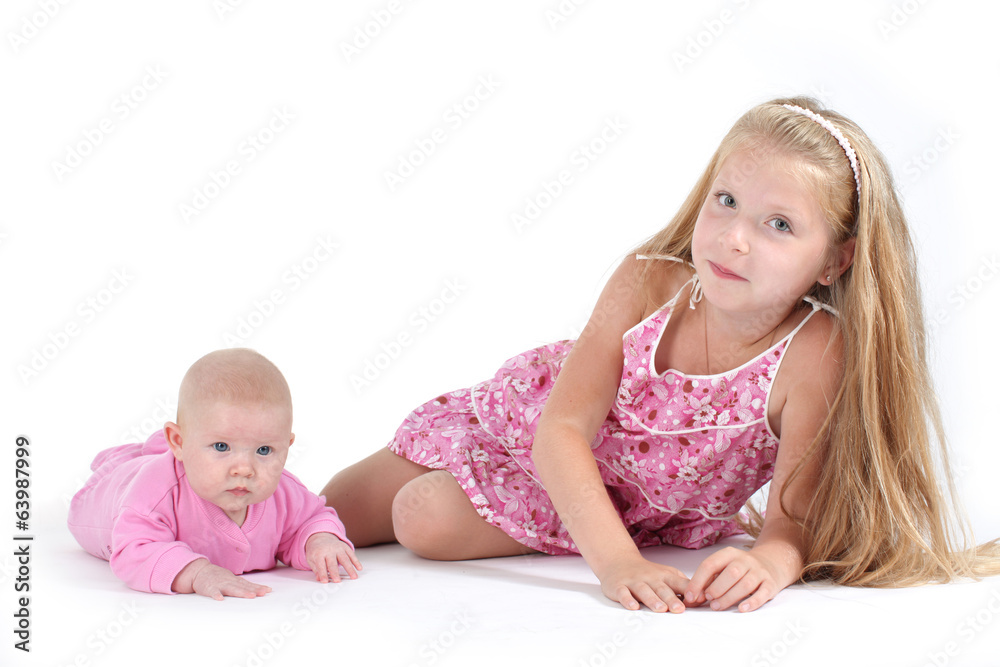 adorable little two sisters 8 year and 3 month old on white back adorable little two sisters 8 year and 3 month old on white back