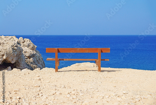 Lonely bench at the seashore